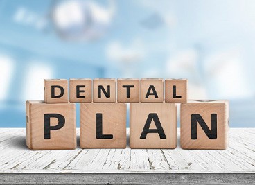 Blocks spell “dental plan”