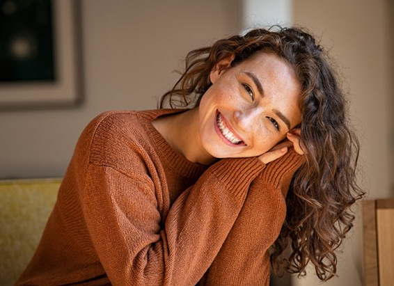 Woman smiling with seamless dental bonding