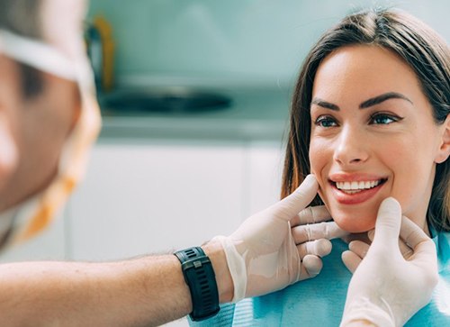 Dentist examining a patient’s smile